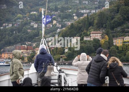 VARENNA, ITALY, OCTOBER 05, 2023, Tourists waiting for the ferry to dock at the harbor of Varenna, lake Como Stock Photo