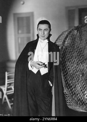 BELA LUGOSI in costume as Count Dracula smokes a cigar during a break in filming DRACULA 1931 Director TOD BROWNING Novel BRAM STOKER Art Director CHARLES D. HALL Cinematographer KARL FREUND Universal Pictures Stock Photo