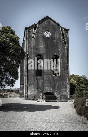 Old tall industrial building at Waihi gold mine in New Zealand Stock Photo