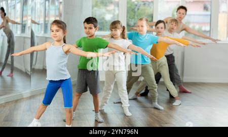 Group of children warming up before dance class Stock Photo