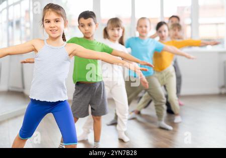 Group of children warming up before dance class Stock Photo