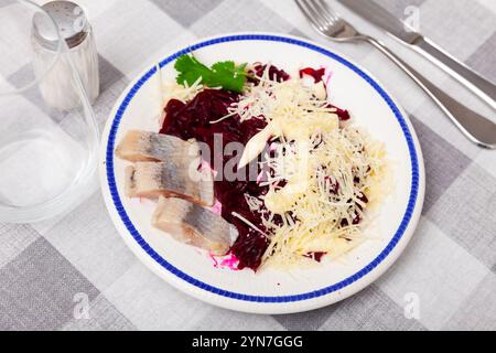 Beetroot served with cheese and pickled mackerel Stock Photo