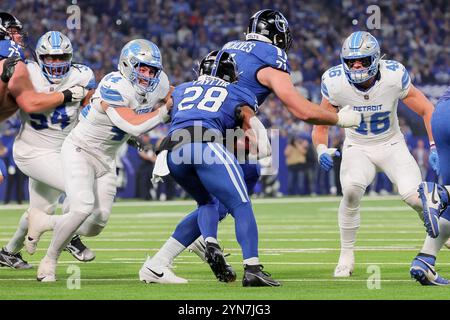 Indianapolis, Indiana, USA. 24th Nov, 2024. Detroit Lions linebacker Malcolm Rodriguez (44) comes across the line to tackle Indianapolis Colts running back Jonathan Taylor (28) during the game between the Detroit Lions and the Indianapolis Colts at Lucas Oil Stadium, Indianapolis, Indiana. (Credit Image: © Scott Stuart/ZUMA Press Wire) EDITORIAL USAGE ONLY! Not for Commercial USAGE! Credit: ZUMA Press, Inc./Alamy Live News Stock Photo