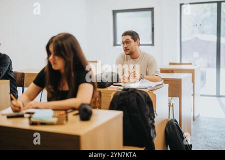 Focused high school students participating in classroom activities Stock Photo