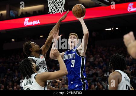 Sacramento, Ca, USA. 24th Nov, 2024. Sacramento Kings guard Kevin Huerter (9) drives to the basket and is fouled by Brooklyn Nets center Nic Claxton (33) during an NBA game at Golden 1 Center on Sunday, Nov. 24, 2024. (Credit Image: © Paul Kitagaki Jr./ZUMA Press Wire) EDITORIAL USAGE ONLY! Not for Commercial USAGE! Credit: ZUMA Press, Inc./Alamy Live News Stock Photo