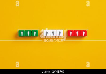 Colorful cubes representing customer groups illustrating market segmentation on a yellow background Stock Photo
