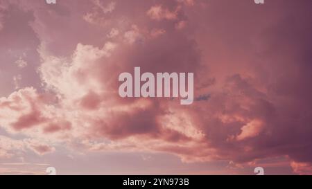 Toned Pink-yellow Clouds. Toned Cumulus Clouds Float In Blue Sky. Saturated Yellow Colors Of Clouds. . Unusual Sky Background. Rich Colors Pink Colors Stock Photo