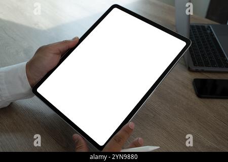 man Hand holding digital tablet replaces your design mockup empty space for logo or text Stock Photo