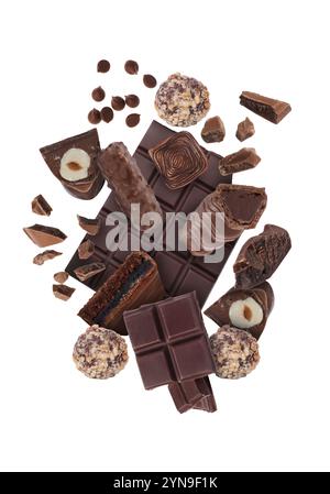 Different chocolate products in air on white background Stock Photo