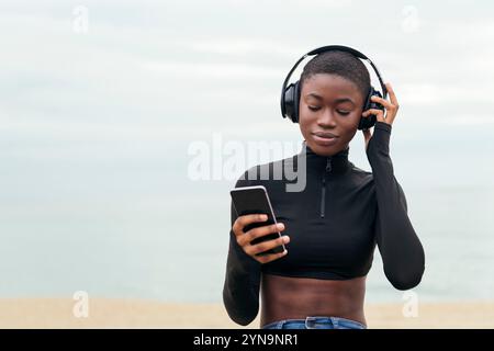dreamy woman listening music in headphones Stock Photo