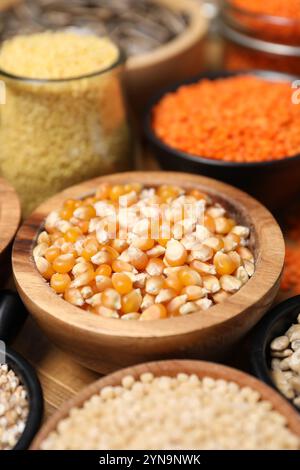 Different types of cereals and legumes on table, closeup Stock Photo