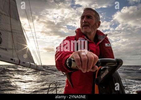 Sailor on the grinder during Sydney to Hobart yacht race, 2015. Stock Photo
