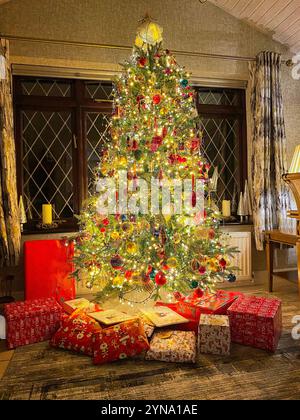 Presents around an English Christmas Tree Stock Photo