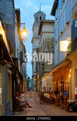 France, Bouches du Rhone, Arles, old city, rue de l'Hôtel de ville street with the Clock Tower of the City Hall in the background Stock Photo