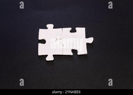 Piece missing from jigsaw puzzle on black background, business concept Stock Photo