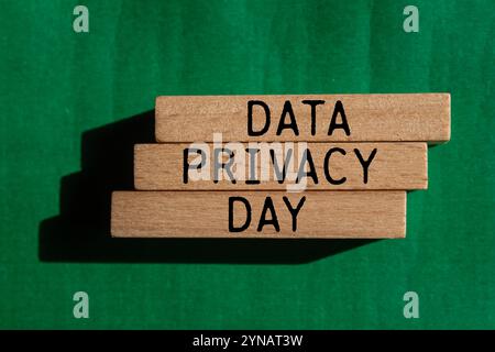 Data privacy day message written on wooden blocks with green background. Conceptual data privacy day symbol. Copy space. Stock Photo