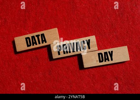 Data privacy day message written on wooden blocks with red background. Conceptual data privacy day symbol. Copy space. Stock Photo