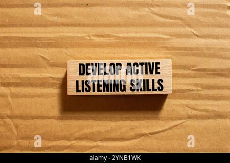 Develop active listening skills message written on ripped torn yellow ...