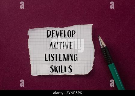 Develop active listening skills message written on round orange sticker ...