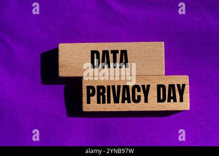Data privacy day message written on wooden blocks with purple background. Conceptual data privacy day symbol. Copy space. Stock Photo