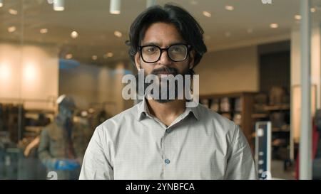 Serious concentrated confident successful bearded indian business man with glasses businessman employee manager salesman representative male Stock Photo