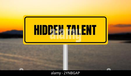 Hidden talent message written on yellow sign with blurry lake background. Conceptual hidden talent symbol. Copy space. Stock Photo