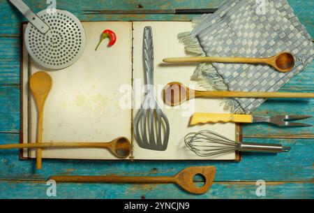 Blank vintage recipe cooking book and old kitchen utensils,free copy space Stock Photo