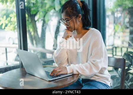 Business women working about new startup on laptop to analysis finance of project in outside office, Woman working using laptop online meeting in home Stock Photo
