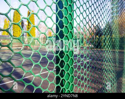 Fragment of a fence made of plastic mesh Stock Photo