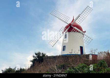 The windmill on Pico das Mentiras is overlooking the town of Santa Cruz da Graciosa, Azores. Stock Photo