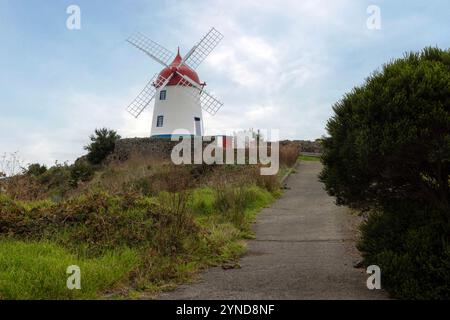 The windmill on Pico das Mentiras is overlooking the town of Santa Cruz da Graciosa, Azores. Stock Photo