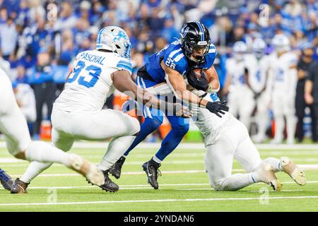 Indianapolis, Indiana, USA. 24th Nov, 2024. Indianapolis Colts running back Jonathan Taylor (28) runs with the ball as Detroit Lions linebacker Malcolm Rodriguez (44) attempts to make the tackle during NFL game action at Lucas Oil Stadium in Indianapolis, Indiana. John Mersits/CSM (Credit Image: © John Mersits/Cal Sport Media). Credit: csm/Alamy Live News Stock Photo