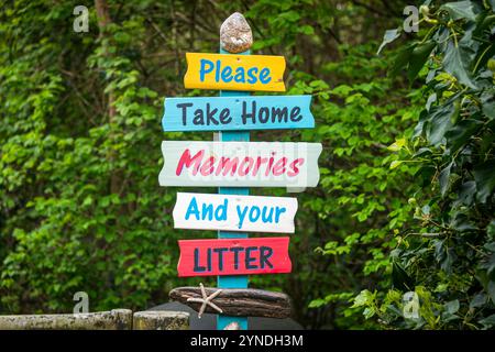 Please take home memories and your litter wooden sign Stock Photo