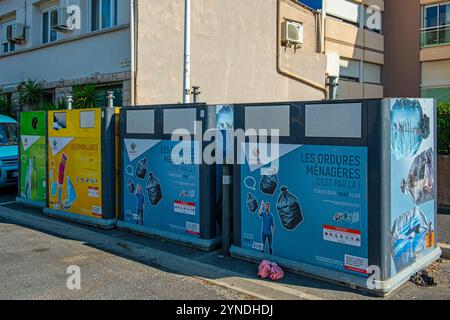 Giant Recycling bins with specific bins for Platsics, general refuse Glass and paper seen in France Stock Photo