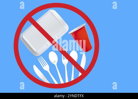 Single use plastic cutlery, styrofoam takeaway boxes and plastic glass on a blue background. Concept: Ban single use plastic items Stock Photo