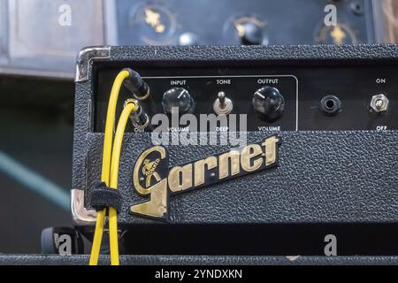 Calgary, Alberta, Canada. Aug 5, 2024. A close-up of a vintage Garnet amplifier. The amplifier has a black control panel with various knobs and switch Stock Photo