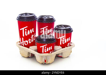 Calgary, Alberta, Canada. May 18, 2021. A trail with Tim Hortons coffee cups of four different sizes Stock Photo