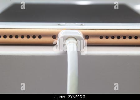 Calgary, Alberta. Canada July 5, 2020. Macro view of an iPhone Plus charging with a lightning USB Cable Stock Photo