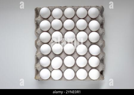 Top view of a Package Cardboard Egg Holder Egg Tray with eggs Stock Photo