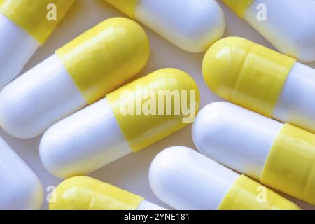 A macro close up to white and yellow capsules Stock Photo