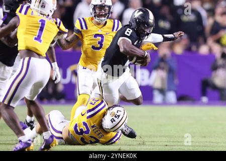 Baton Rouge, United States. 23rd Nov, 2024. LSU Tigers linebacker West Weeks (33) tackles Vanderbilt Commodores quarterback Nate Johnson (8) during the first half of a Southeastern Conference football game at Tiger Stadium on Saturday, November 23, 2024 in Baton Rouge, Louisiana. (Photo by Peter G. Forest/Sipa USA) Credit: Sipa USA/Alamy Live News Stock Photo