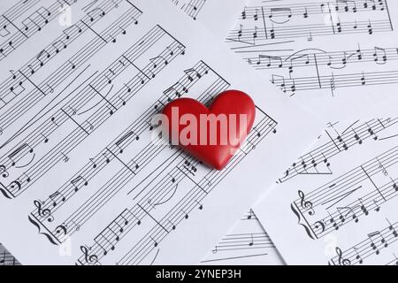 Heart figure on musical note sheets, closeup Stock Photo