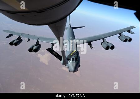 A U.S. Air Force B-52H Stratofortress prepares to receive fuel from a KC-135 Stratotanker over the U.S. Central Command area of responsibility Nov. 23, 2024.  The bomber deployment underscores the United States’ commitment to regional security and demonstrates the U.S. military’s unique ability to rapidly deploy worldwide on short notice in response to crises and contingencies. (U.S. Air Force photo) Stock Photo