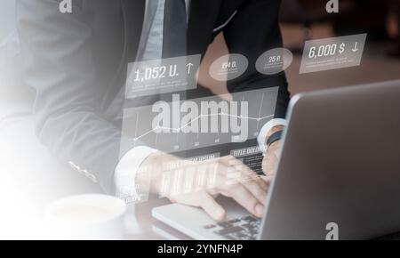 Businessman using laptop computer analyzing sales data and financial growth graph chart report. Business planning, strategy and development. Financial Stock Photo