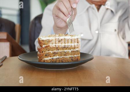 An Indulgent Slice of Deliciously Moist Carrot Cake Served in a Chic Modern Cafe Setting Stock Photo