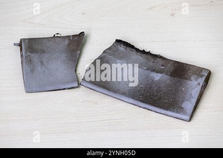 Broken parts of old kitchen exhaust fan. It has become dirty because it has not been cleaned for a long time. Stock Photo