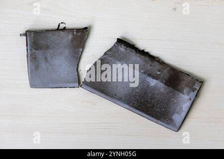 Broken parts of an old, dirty kitchen exhaust fan. Stock Photo