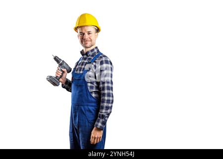Smiling builder with a hard hat holding a cordless screwdriver isolated on white Stock Photo