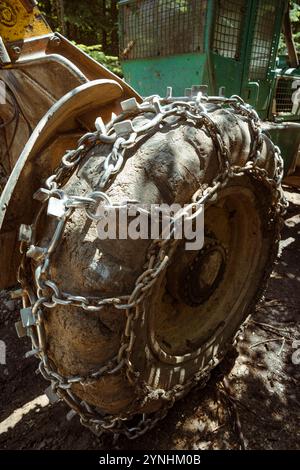 Giant wheels equipped with chains for mud. Stock Photo