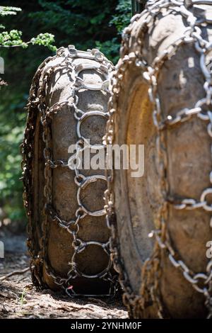 Giant wheels equipped with chains for mud. Stock Photo